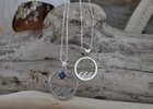Custom designed sterling silver Necklaces. With stone and without. Large is about a quarter in size.  Small necklace is about the size of a penny.